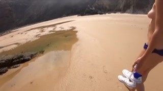 kiss1couple - Handjob on the beach behind the rocks